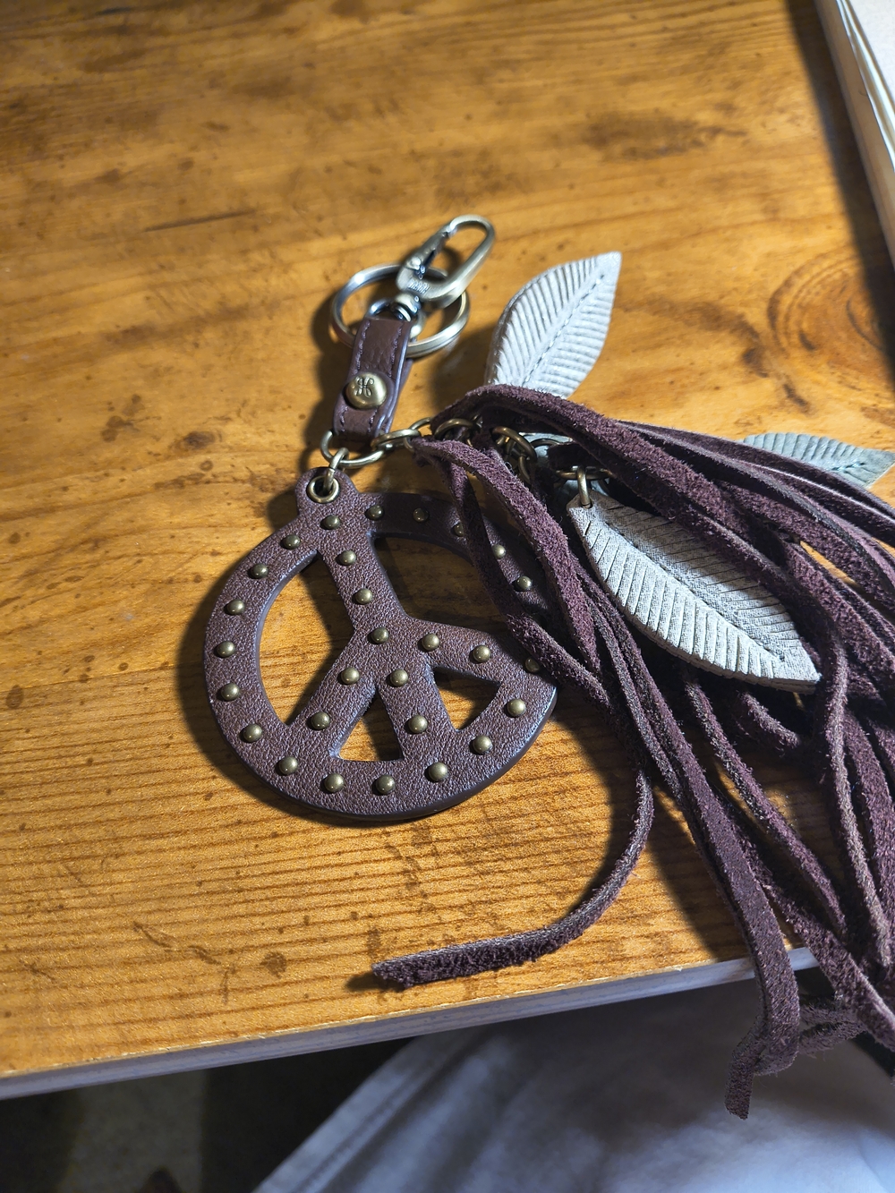 HOBO Dark Brown Studded Peace Sign Tassel Key Fob Purse Charm.